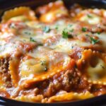 Let’s talk comfort food that’s also ridiculously easy. This Crockpot Ravioli Lasagna is perfect for those nights when you want lasagna but without the hassle. It’s got all the good stuff—cheesy ravioli, hearty beef, and layers of melty goodness—all cooked to perfection in your slow cooker. The best part? It only takes minutes to prep!