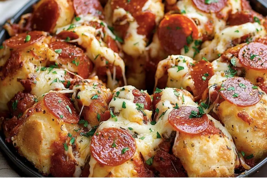 This Pizza Monkey Bread is the ultimate pull-apart snack, loaded with pepperoni, mozzarella, and parmesan cheese, all packed into bite-sized pieces of buttery biscuit dough. Perfect for parties, game days, or a fun family dinner!