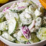 This Creamy Cucumber Salad is a refreshing side dish, perfect for summer or any meal. With crisp cucumbers, tangy sour cream dressing, and a hint of garlic and dill, it's both light and flavorful. Simple to prepare, this salad is ideal for barbecues, potlucks, or a quick weekday side.