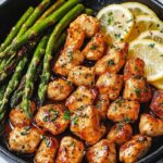 Tender chicken bites sautéed in garlic butter and served with bright, lemony asparagus. This quick and flavorful dish is perfect for a weeknight meal that's both light and satisfying.