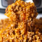 This Instant Pot Cheesy Taco Ground Beef and Rice is the ultimate one-pot meal for when you’re craving something hearty, cheesy, and just a little bit spicy. It’s got all the best taco flavors packed into a cozy, cheesy rice dish. Plus, it’s super quick and easy to make in your Instant Pot!